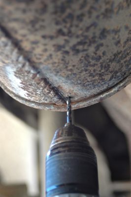 muffler_drain_hole_drill