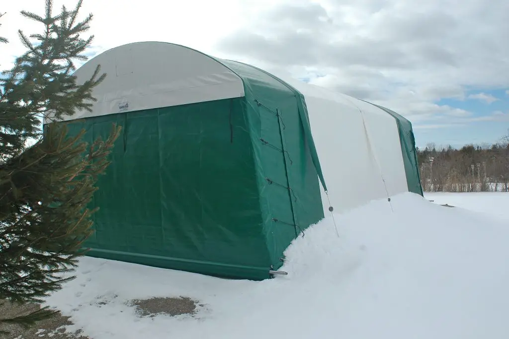 portable garage snow covered